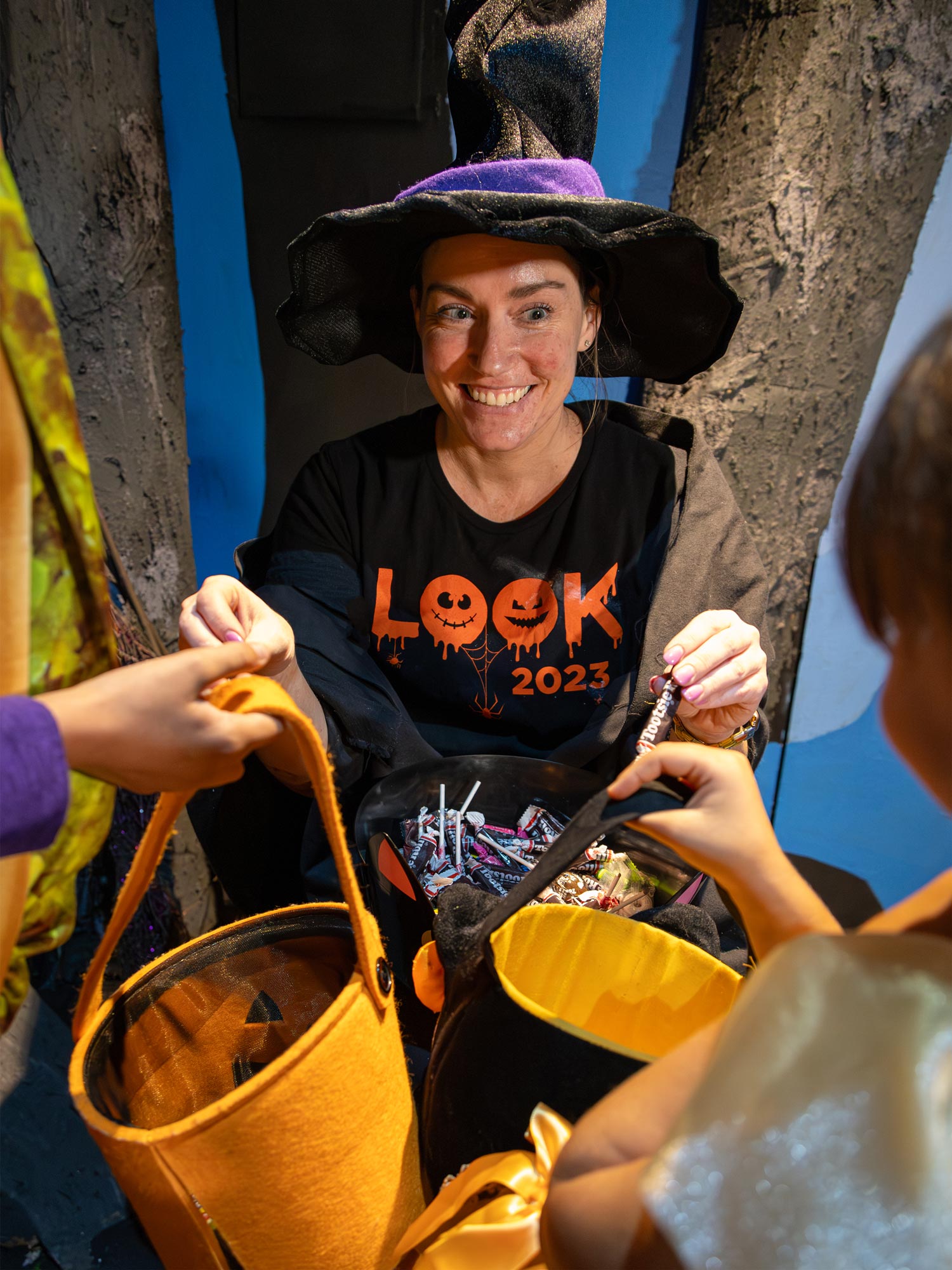 Friendly witch handing out candy.